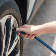 Person filling up their tire